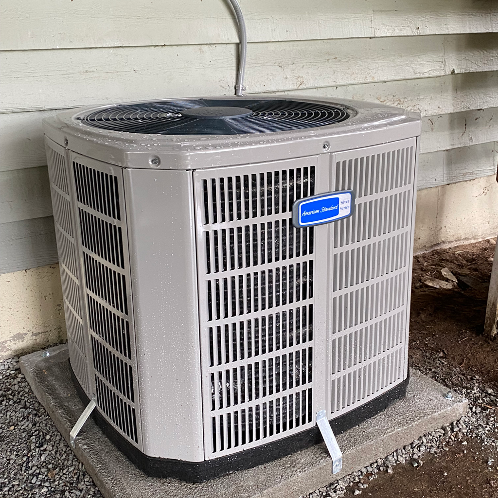 American Standard Air Conditioning Unit on Outdoor Pad.